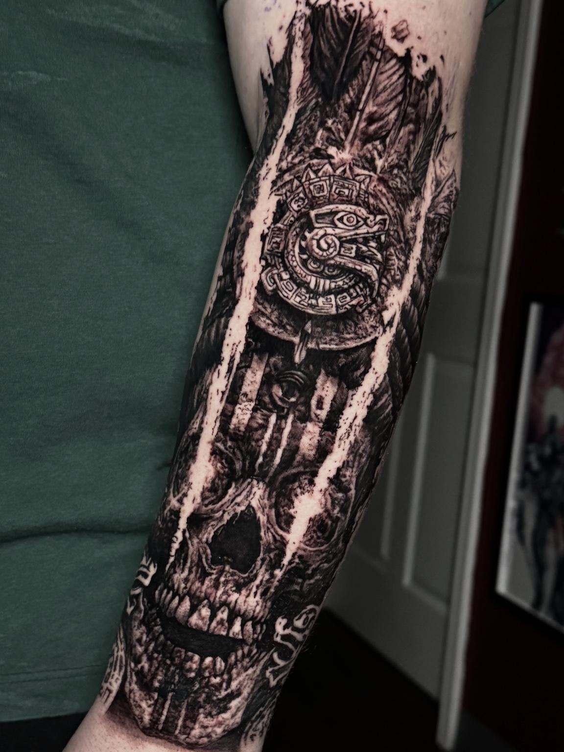 Black and grey skull and landscape tattoo by Maverick Mayes