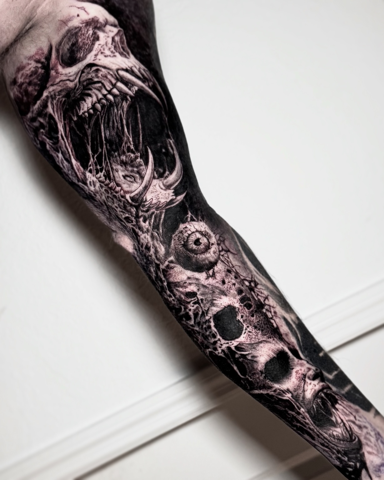Black and grey horror sleeve tattoo by Maverick Mayes