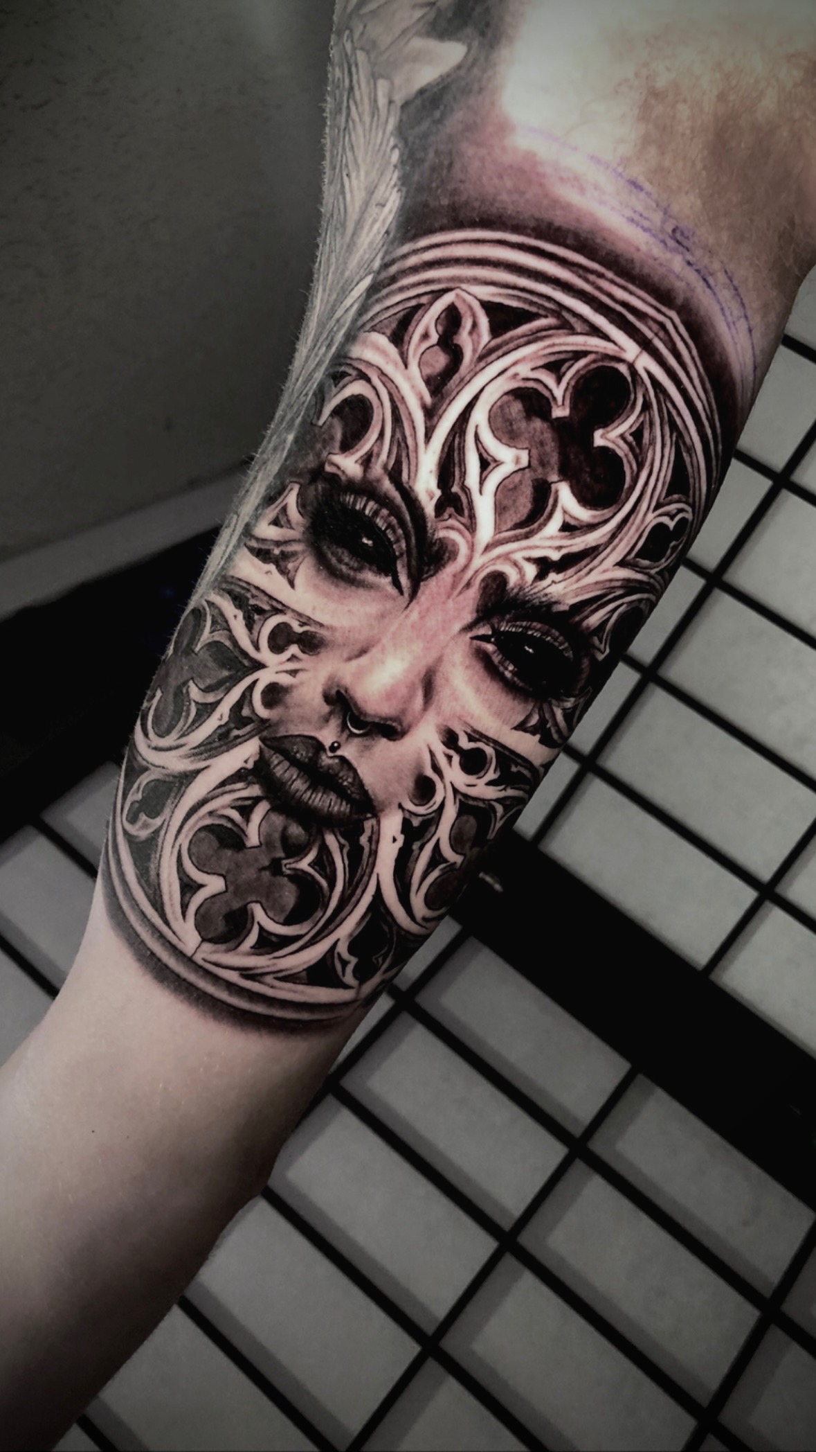 Ornamental black and grey forearm tattoo by Maverick Mayes