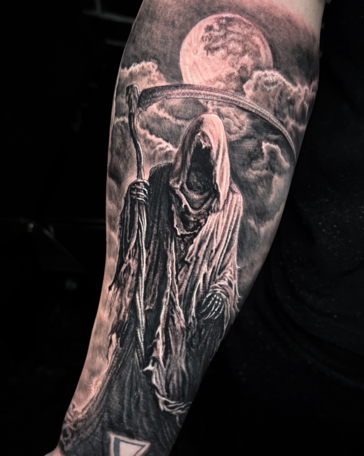 Black and grey hooded reaper tattoo by Maverick Mayes